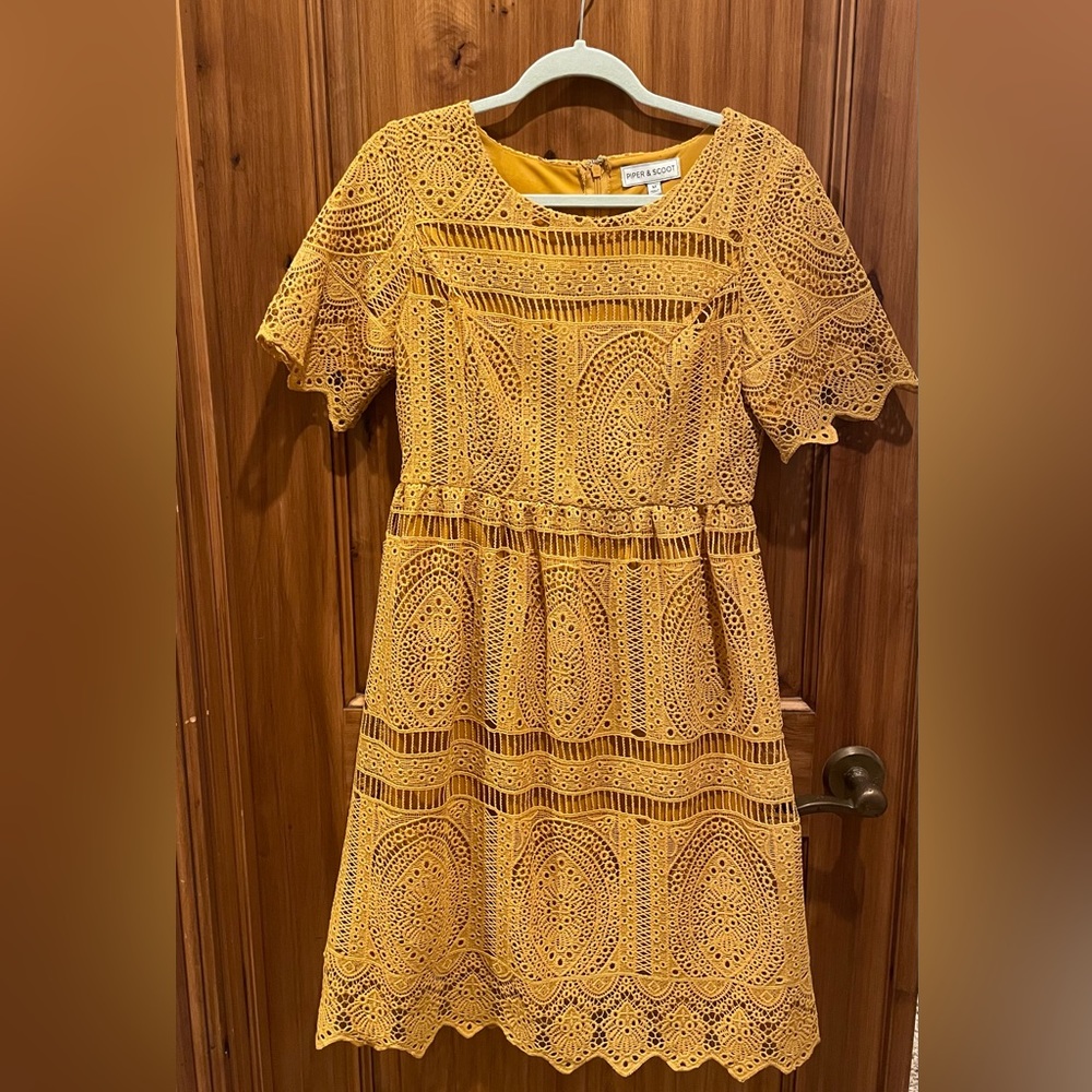 Golden yellow true embroidery. Lightly worn